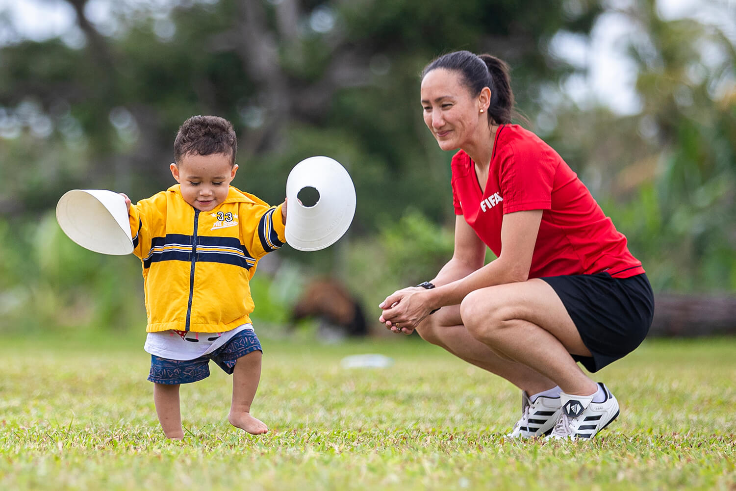 child and a sports coach